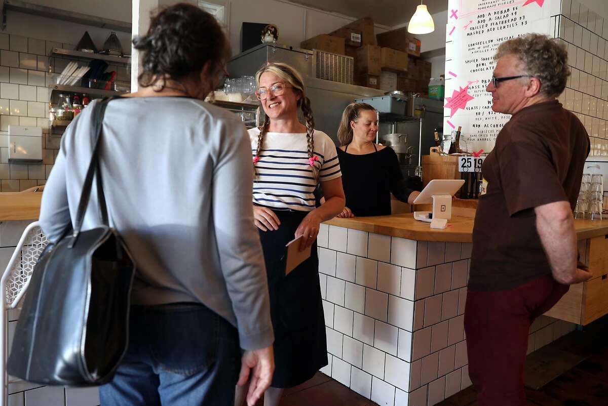 Allison Hopelain greets diners at Kebabery in Oakland, Calif. on Monday, July 17, 2017.