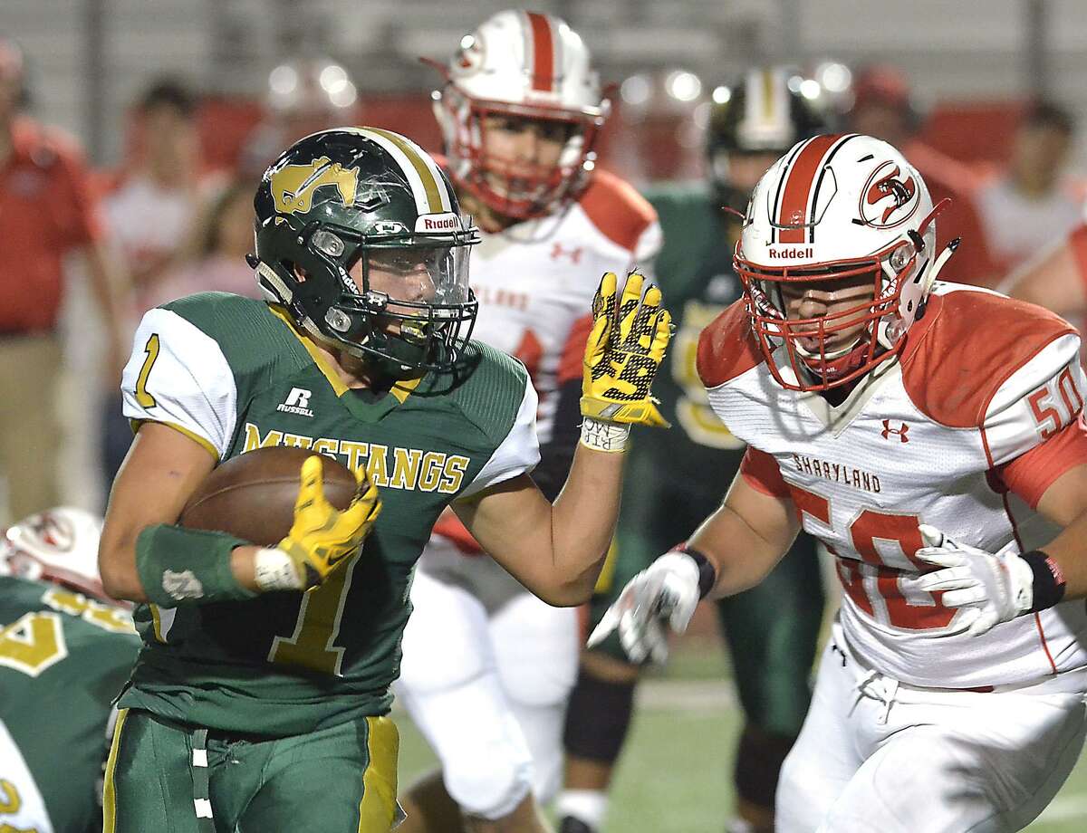 Running back Branden Gutierrez carries the ball in Saturday's district game between the Nixon Mustangs and the Sharyland Rattlers at Shirley Field.