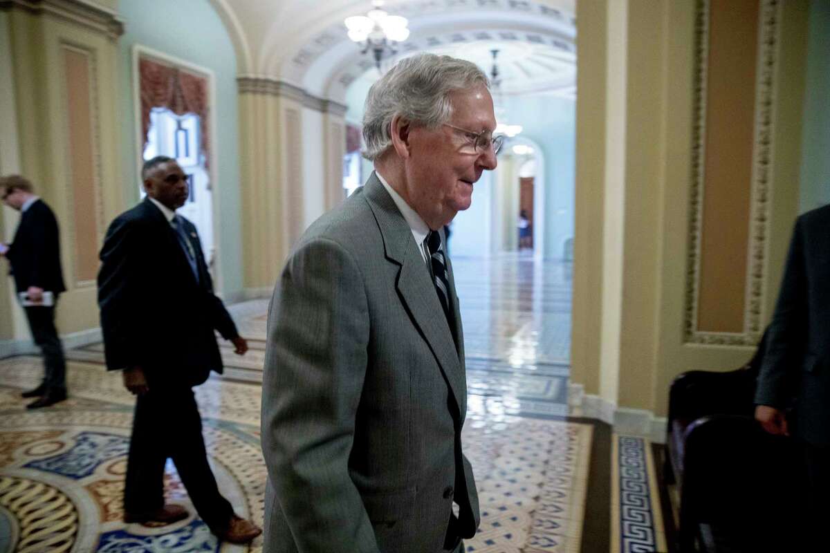 Senate Majority Leader Mitch McConnell of Ky. walks into the Senate Chamber on Capitol Hill, Thursday, July 20, 2017, in Washington. (AP Photo/Andrew Harnik) ORG XMIT: DCAH145