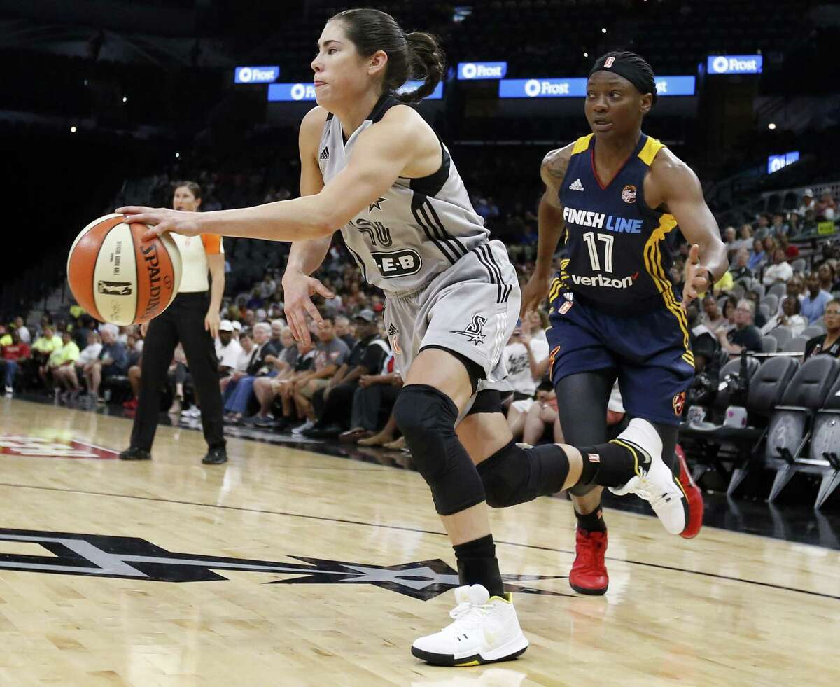 Kelsey Plum, who scored a career-high 16 points, drives past the Fever’s Erica Wheeler during the first half Thursday night.