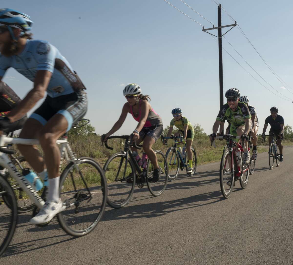 Members of the Permian Basin Bicycle Association make their way along county road south of Midland in June. A two-year study shows that beginning an exercise routine before age 65 can reduce chance of heart failure.