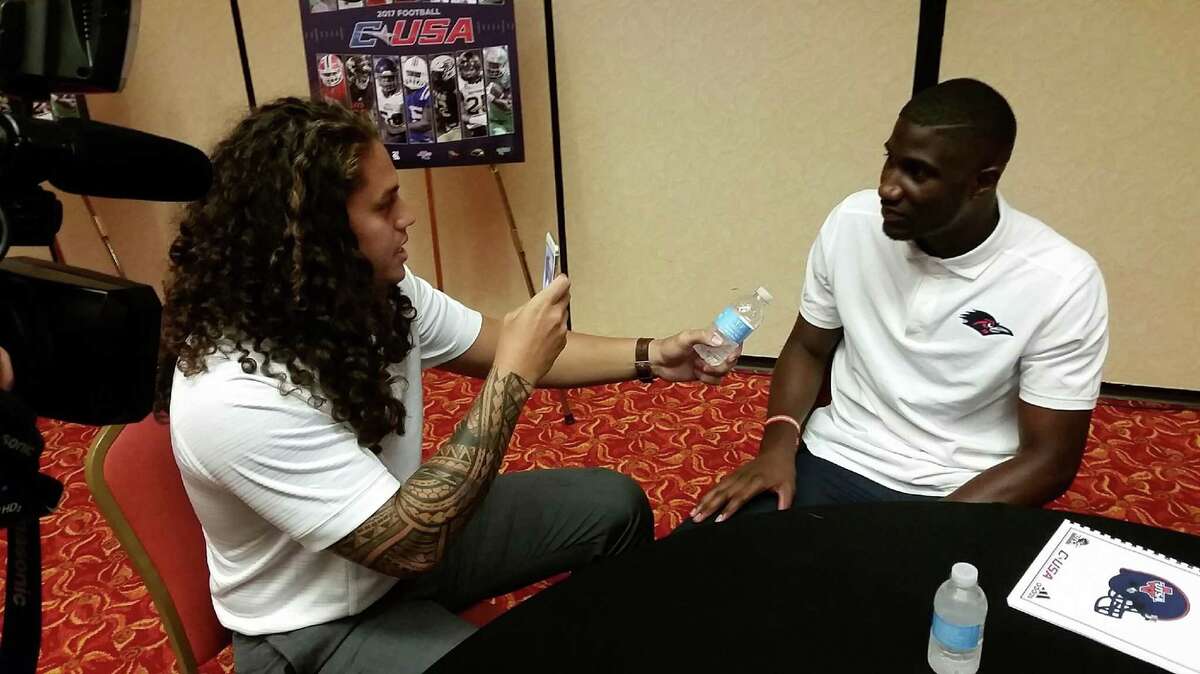 Roadrunner teammates Josiah Tauaefa (left) and Josh Stewart interview each other in Irving.