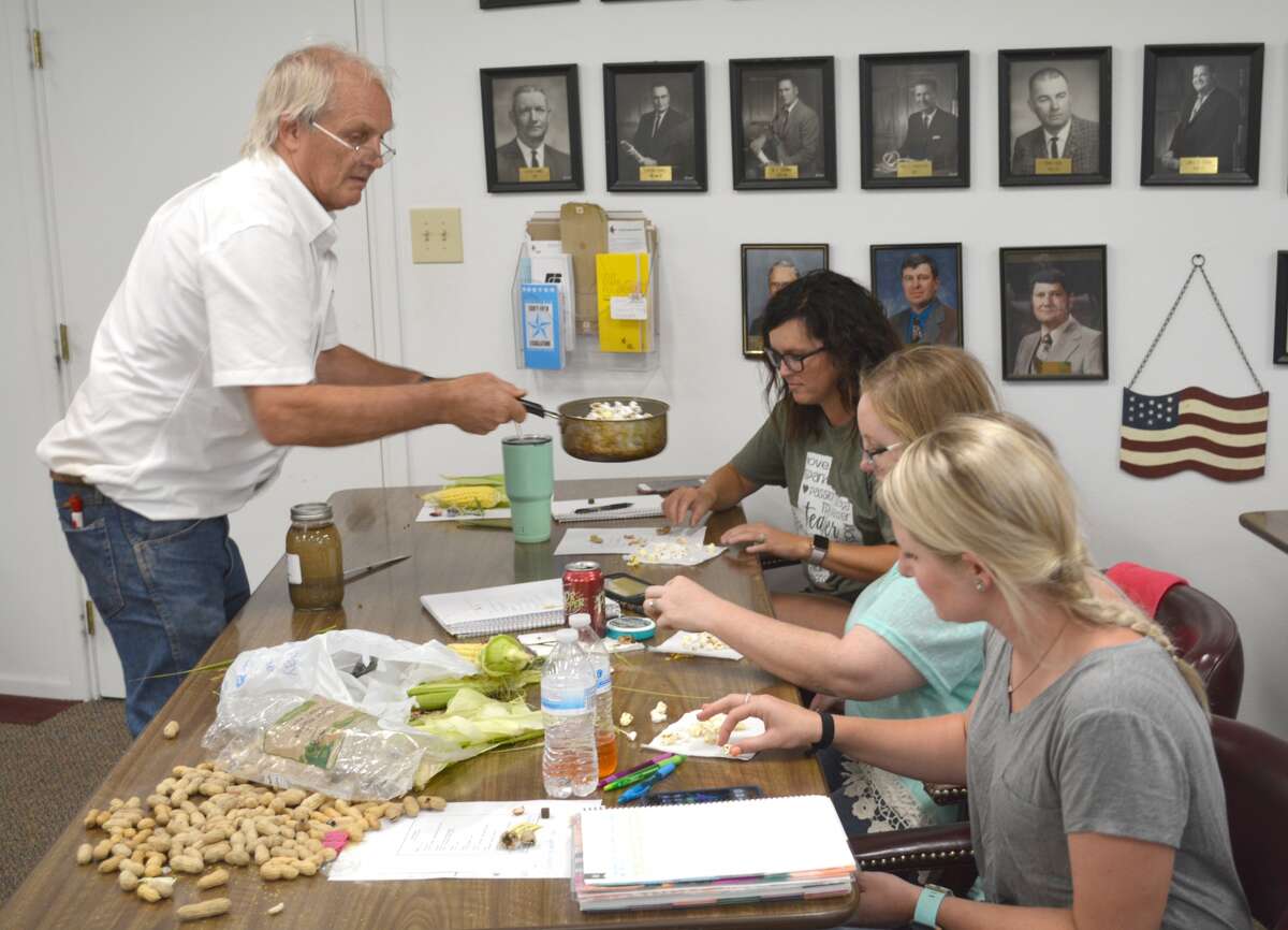 Dr. Craig Wilson, senior research associate with USDA/Texas A&M University in College Station, asks area science teachers to sample both yellow and white popcorn to determine which is sweeter on Thursday during the 2017 Summer Science Workshop. K-8th grade science teachers from Cotton Center, Hart, Silverton, Post and Wilson ISDs attended the annual workshop at the Hale County Farm Bureau office in Plainview to learn strategies on incorporating aspects of production agriculture in the classroom. Topics included germination, flowering plants, water absorption in various soil types and food production, reports Jett Mason, TFB’s director of educational outreach. Sponsored included Hale County Farm Bureau, Ag Texas, Plains Land Bank, Texas Cotton Producers and TFB.