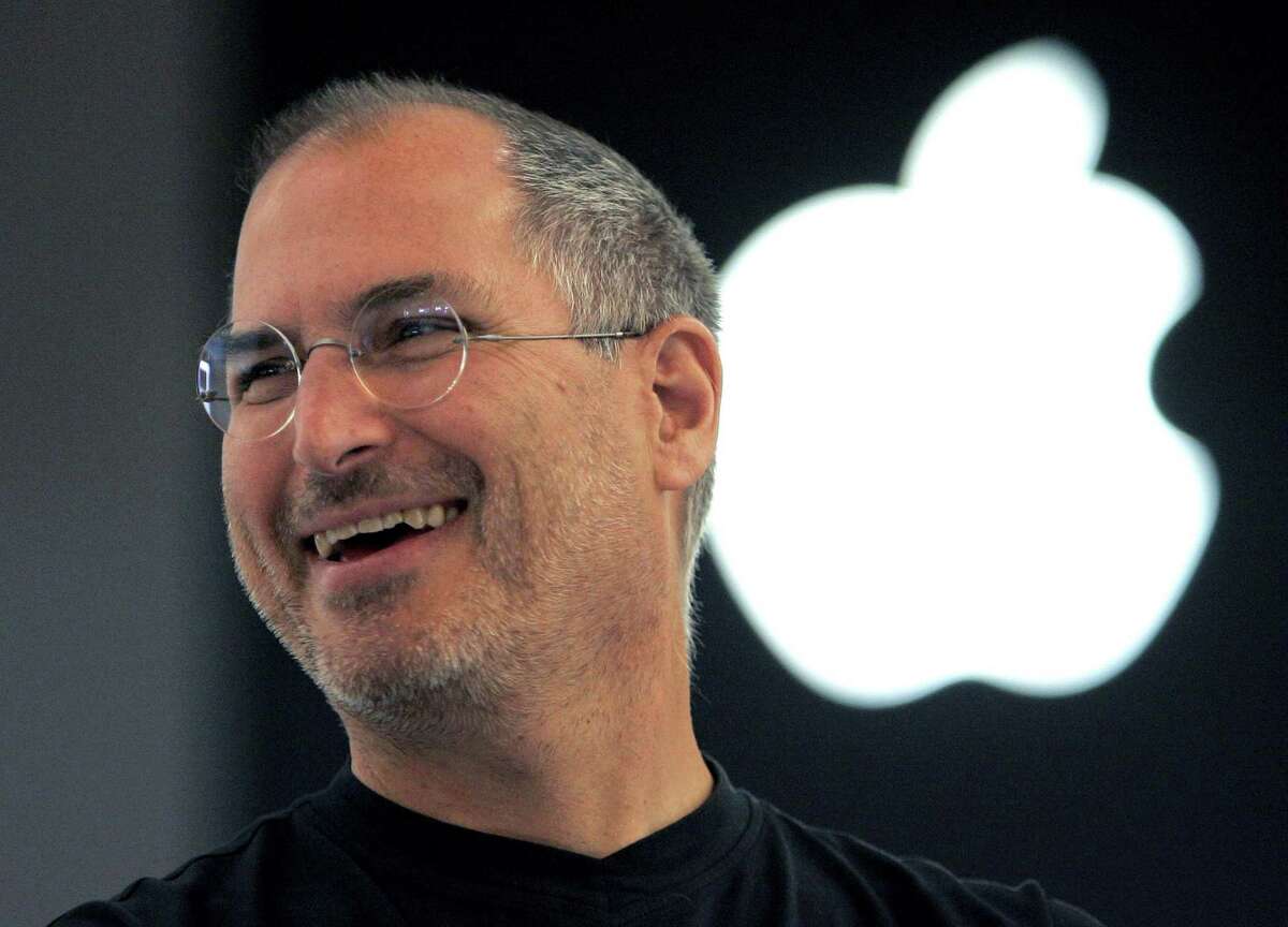 FILE - In this Sept. 20, 2005 file photo, Apple co-founder Steve Jobs smiles after a press conference as he opens the Apple Expo in Paris. Since his death in 2011, Jobs has been the subject of documentaries, books, a film, even a graphic novel. Now the technology pioneer will be the focus of an upcoming opera. In front of the Sangre de Cristo mountains in northern New Mexico, the Santa Fe Opera announced Wednesday, Aug. 5, that its latest commission will be based on the man who helped revolutionize personal computers, the music business and, of course, brought the world the iPhone.