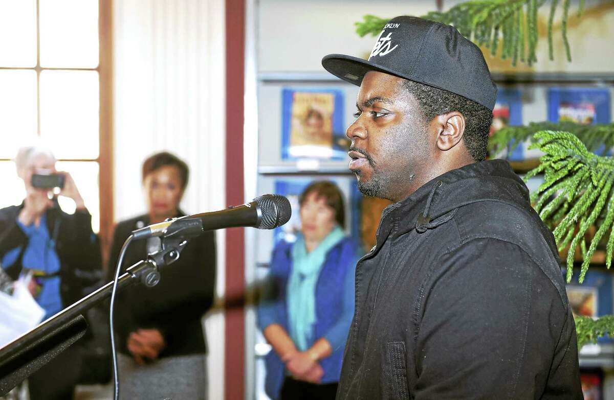 (Arnold Gold-New Haven Register) Keishar Tucker, a survivor of solitary confinement, speaks during a press conference about his experience at the New Haven Free Public Library on 1/30/2017. The library is hosting the display, Inside the Box, will travel to Yale University's Sterling Memorial Library and then to the Lillian Goldman Law Library at the Yale Law School over a three week period and will be accompanied by various programming concerning solitary confinement.