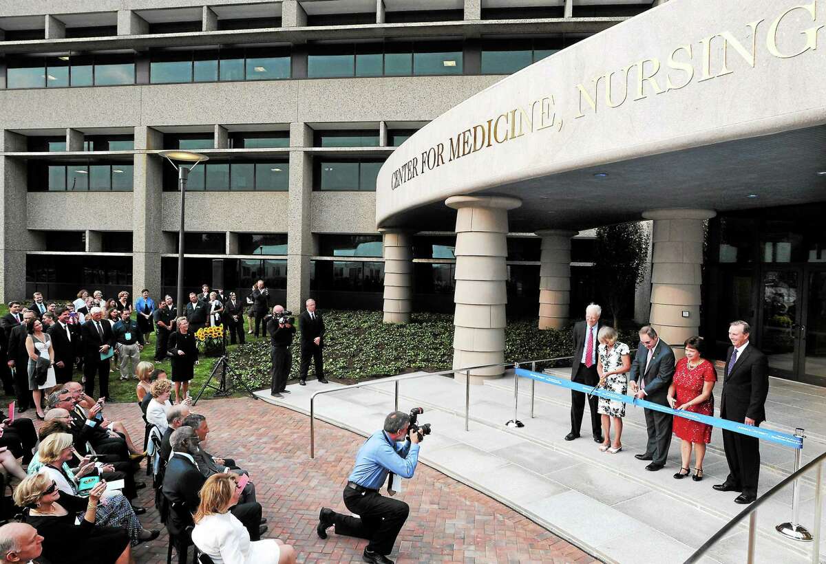 (Mara Lavitt — New Haven Register) September 12, 2013 North Haven.Quinnipiac University ribbon cutting for the Center for Medicine, Nursing and Health Sciences, as well as the dedication of the Frank H. Netter MD School of Medicine, on the former Anthem campus, North Haven. QU president John Lahey is at right.