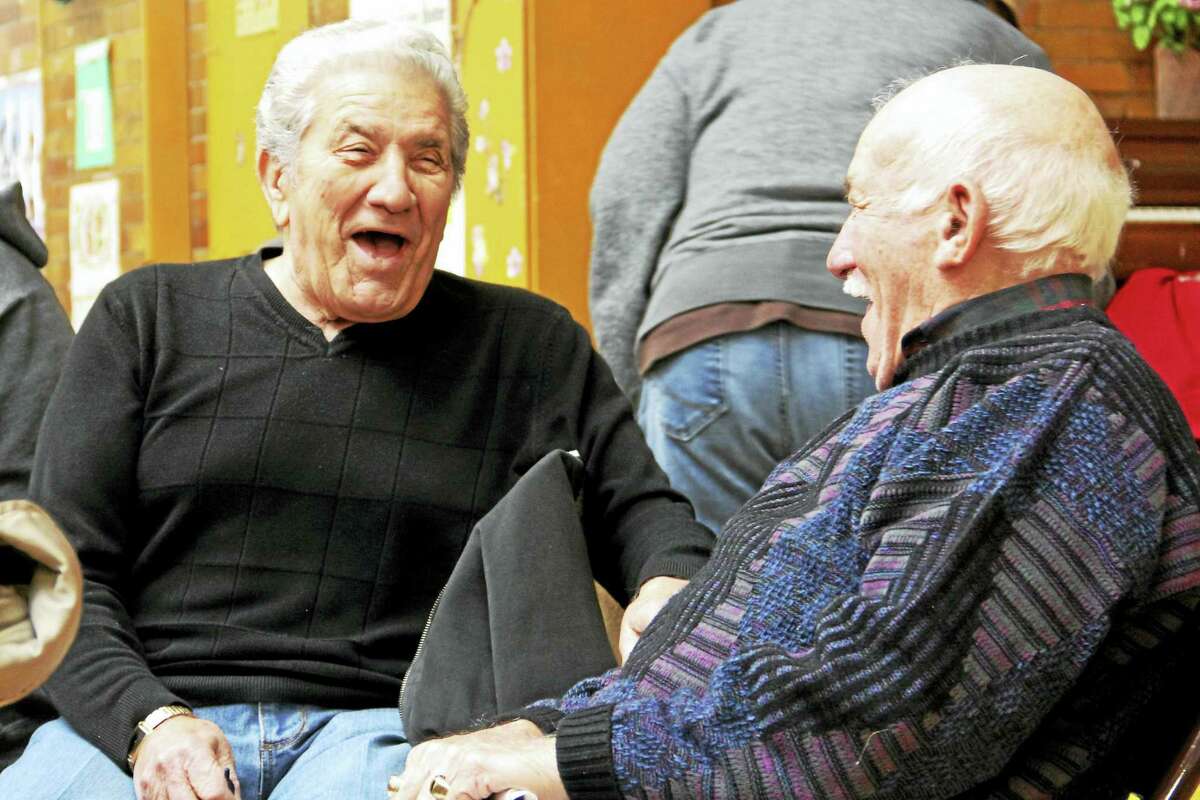 First cousins Anthony Esposito (left) and Anthony Serio laugh during some down time Wednesday, Jan. 20, at the Atwater Senior Center in New Haven. Esteban L. Hernandez New Haven Register
