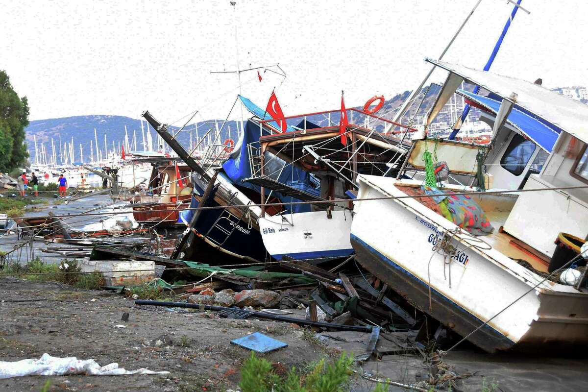 Boats that crashed on top of each other in the harbor in Bodrum, Turkey, in the overnight earthquake are seen, Friday, July 21, 2017. A powerful earthquake sent a building crashing down on tourists at a bar on the Greek holiday island of Kos and struck panic on the nearby shores of Turkey early Friday, killing people and injuring some 200 people. (Yasar Anter/DHA-Depo Photos via AP)