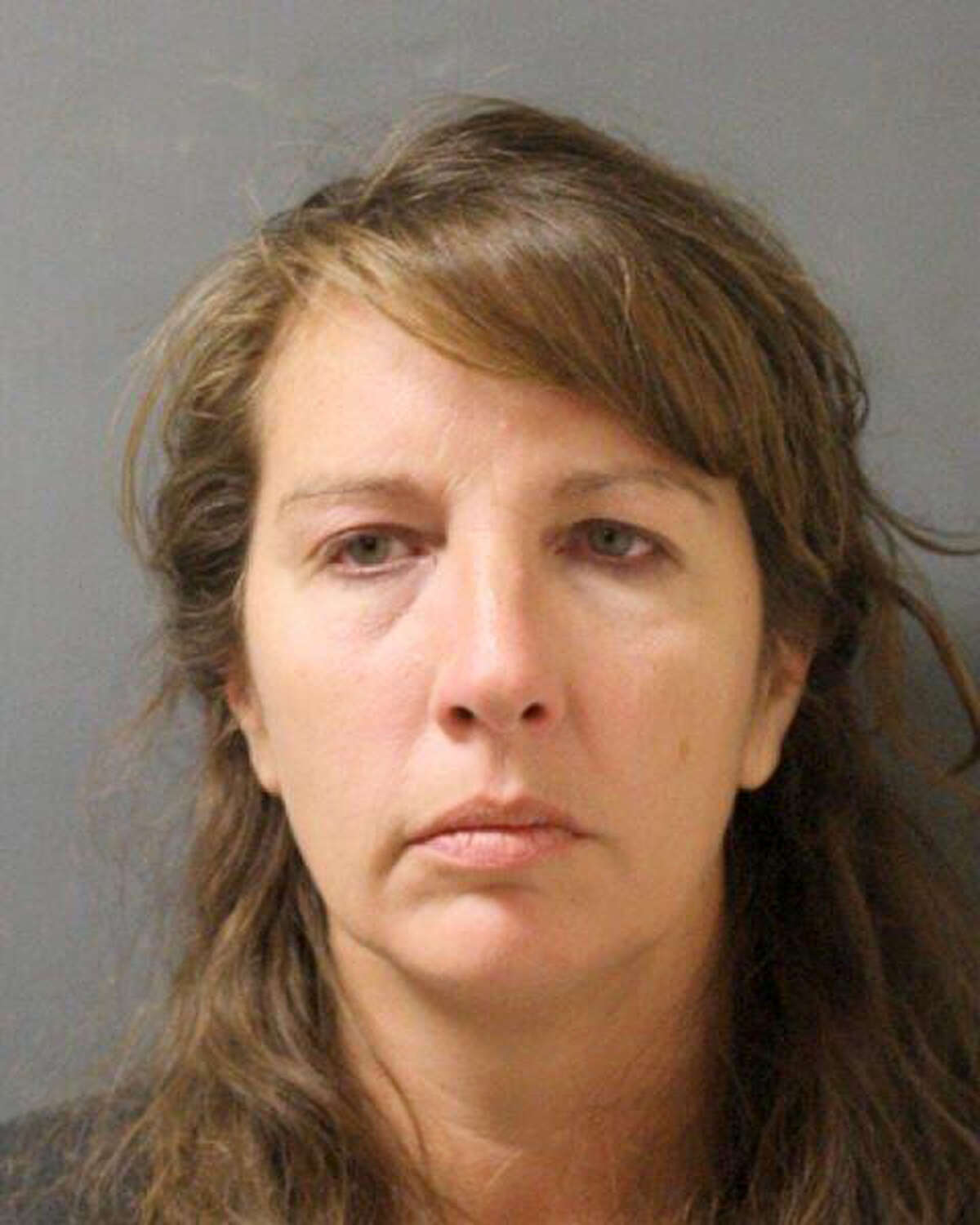 This undated photo provided by the Harris County Sheriff's Office shows the booking photo of Houston-area sheriff's deputy Chauna Thompson. The Harris County sheriff's office said Friday, June 9, 2017, that Thompson and her husband Terry Thompson have posted bail and that they have a court hearing scheduled for Tuesday, after they surrendered to authorities late Thursday after a grand jury that day handed up separate indictments against them. The Thompson's are accused of causing the May 28 death of 24-year-old John Hernandez outside a Houston-area restaurant. (Harris County Sheriff's Office via AP)