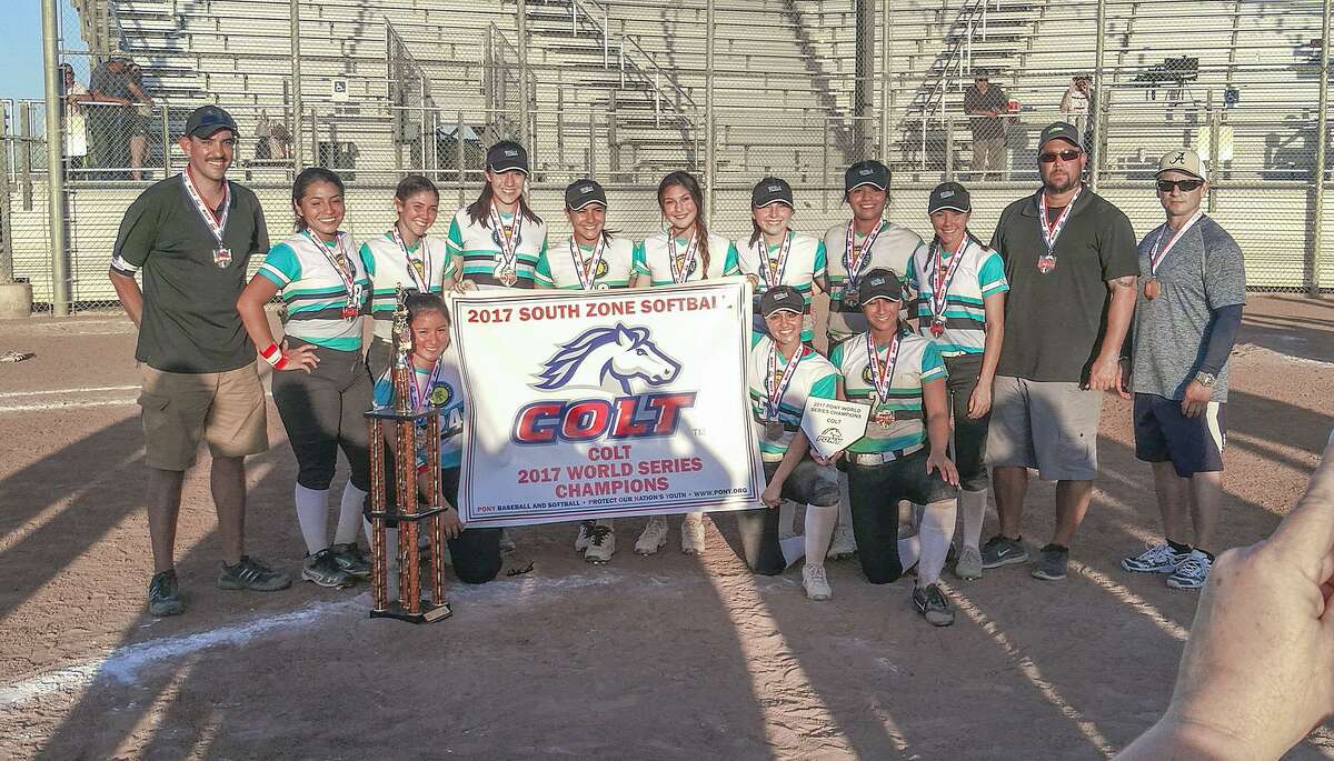 The Laredo Triple Threat softball team poses for a photo with their championship banner and trophy on Friday, July 21, 2017 after winning the PONY League Colt Division at the Bill Johnson Student Activity Complex.