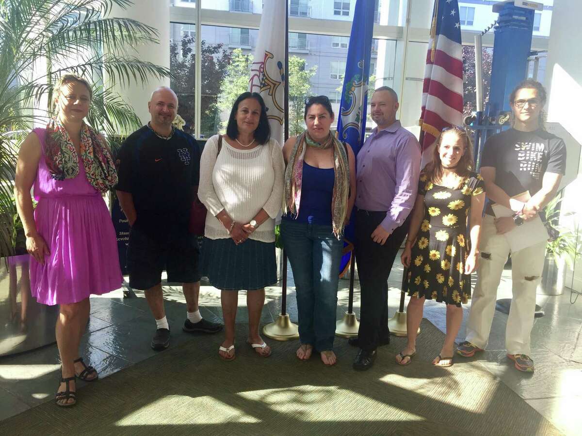 From left, Ines Saftic, Marc Aquila, Susan Buchsbaum, Megan Cottrell, Robert Roqueta, Nina Sherwood and Raven Matherne in the lobby of the Stamford Government Center.