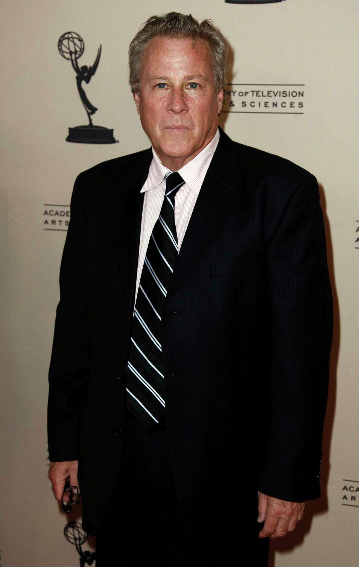 FILE - In this Sept. 12, 2011 file photo, actor John Heard arrives at Academy of Television Arts and Sciences Producers Peer Group celebration of the 63rd Primetime Emmy Awards in Los Angeles. Heard, best known for playing the father in the Â?“Home AloneÂ?” movie series, has died. He was 72. His death was confirmed by the Santa Clara Medical ExaminerÂ?’s office in California on Saturday, July 22, 2017. (AP Photo/Matt Sayles, File)