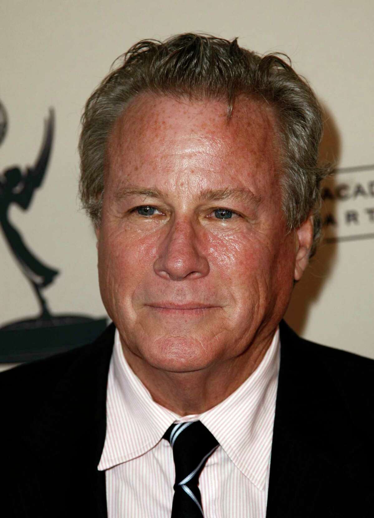 FILE - In this Sept. 12, 2011 file photo, actor John Heard arrives at Academy of Television Arts and Sciences Producers Peer Group celebration of the 63rd Primetime Emmy Awards in Los Angeles. Heard, best known for playing the father in the Â?“Home AloneÂ?” movie series, has died. He was 72. His death was confirmed by the Santa Clara Medical ExaminerÂ?’s office in California on Saturday, July 22, 2017. (AP Photo/Matt Sayles)