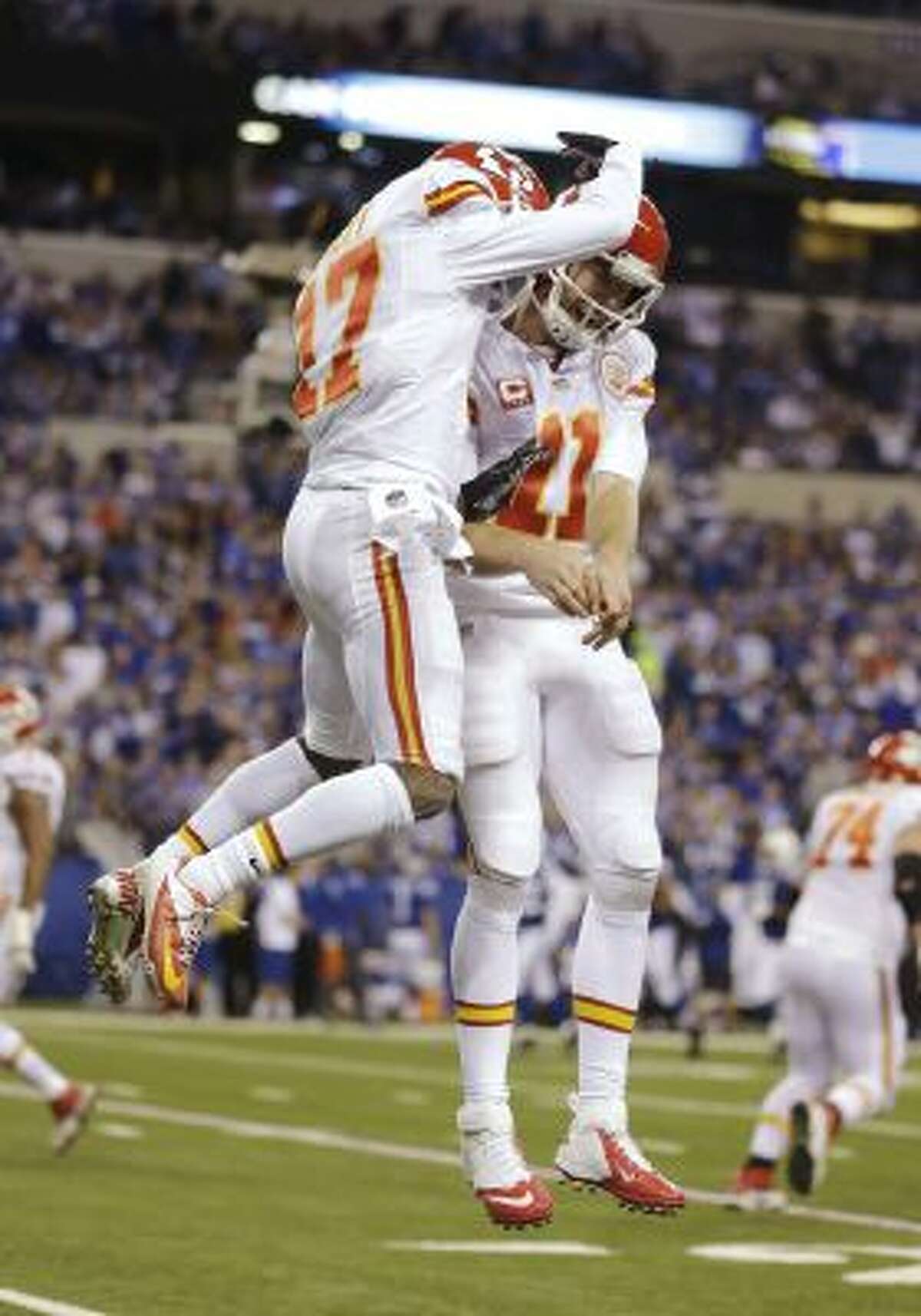 After scoring a touchdown against the Kansas City Chiefs, Indianapolis Colts  quarterback Andrew Luck (12) celebrates during the second half of an NFL  wild-card playoff football game Saturday, Jan. 4, 2014, in