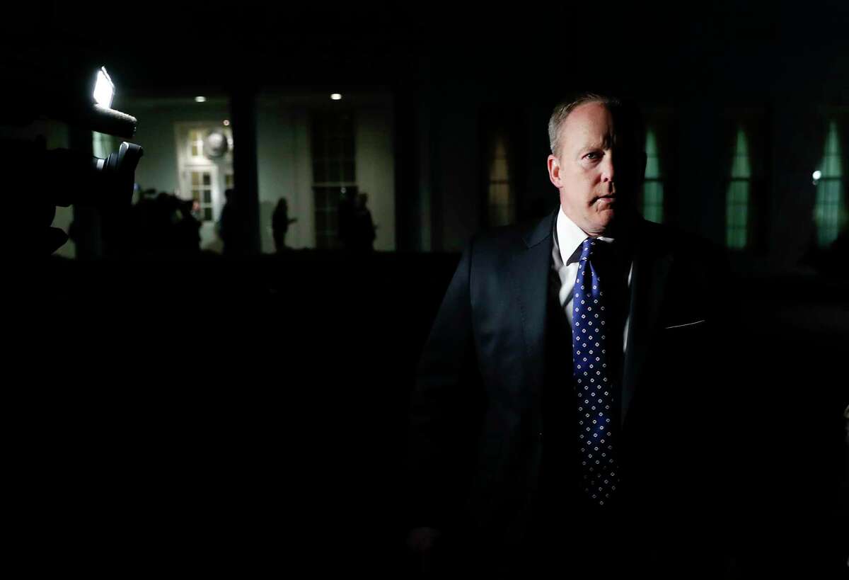 FILE - In this May 9, 2017, file photo, White House press secretary Sean Spicer walks from the West Wing of White House, in Washington to speak to reporters after President Donald Trump abruptly fired FBI Director Comey. Almost from Day One, it was clear that Sean Spicer would ride a uniquely rocky and humiliating road as President Donald TrumpÂ?’s White House press secretary. (AP Photo/Carolyn Kaster, File)
