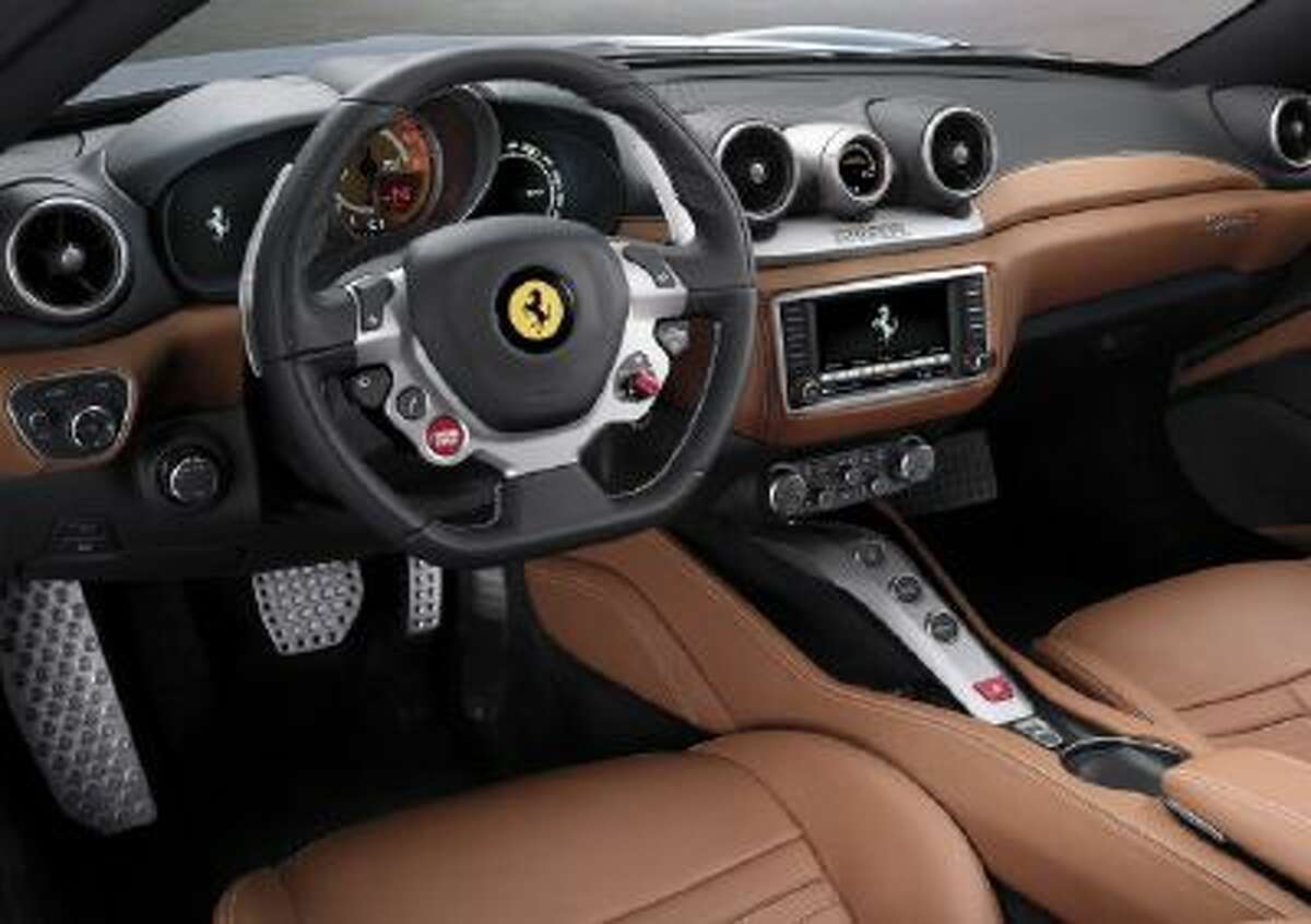 Inside the car gets a new touch screen and the same multifunction steering wheel found in the 458 Italia and F12 Berlinetta.