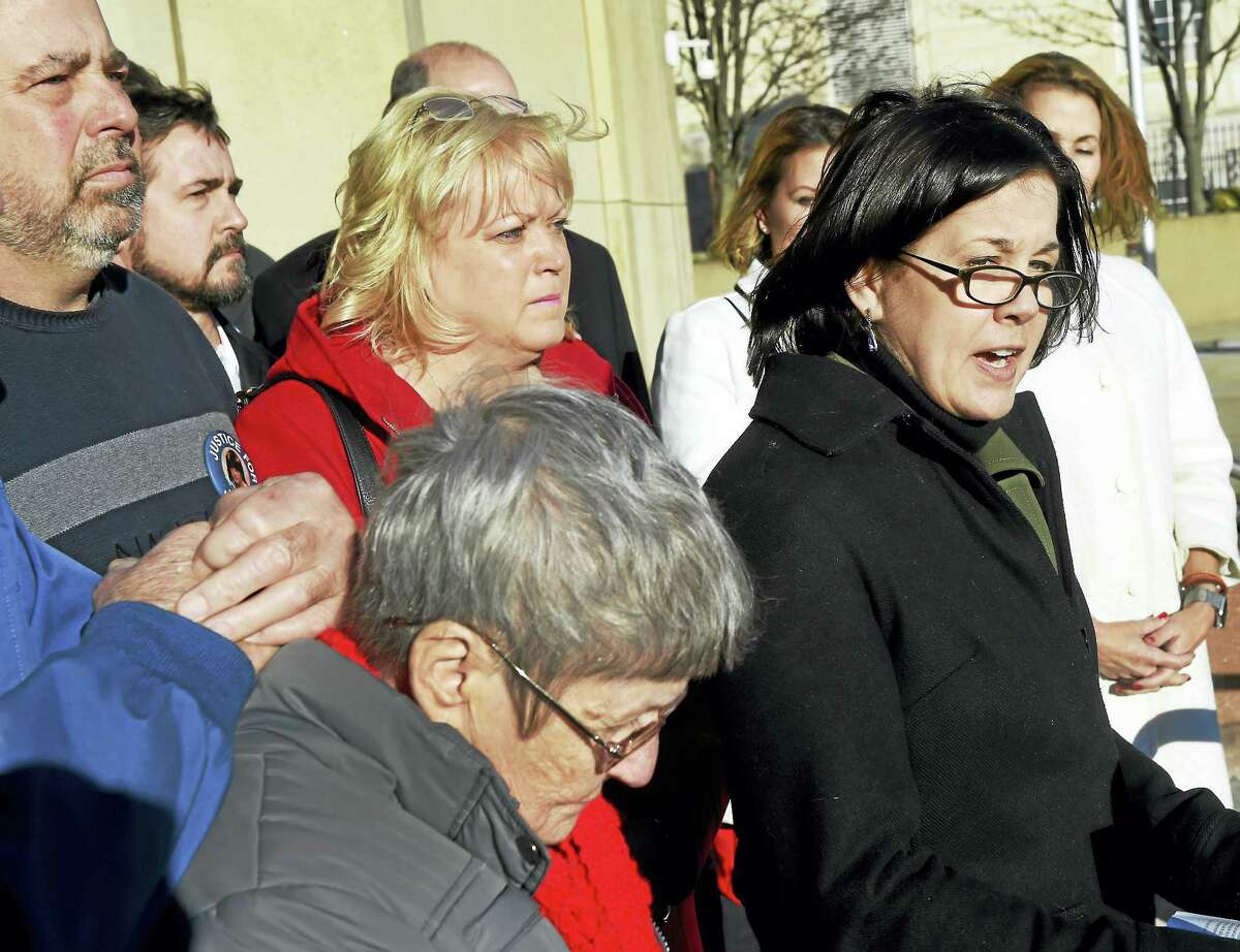 (Peter Hvizdak - New Haven Register)Marianne V. Stochmal Heffernan, with her family, speaks on the steps of Waterbury Superior Court Thursday afternoon, March 2, 2017 decrying the Connecticut Innocence Project and the court-ordered release from prison of David Weinberg who was convicted of murdering her sister in 1984. The release was ordered after Weinberg served 26-years of a 60 year prison sentence. Weinberg will still be classified as a murderer although the Innocence Project raised doubts about his conviction.