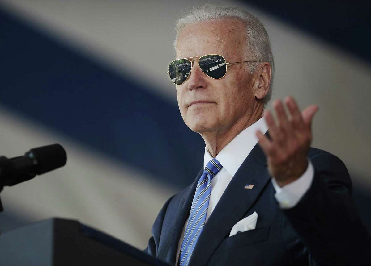 FILE - In this May 17, 2015, file photo, Vice President Joe Biden gestures after donning a pair of sunglasses as he delivers the Class Day Address at Yale University in New Haven, Conn. Graduation season is winding down but among the eight commencement addresses given this year by three of the biggest names, President Barack Obama, first lady Michelle Obama and Vice President Joe Biden, a few moments stood out that may last a little longer. (AP Photo/Jessica Hill, File)