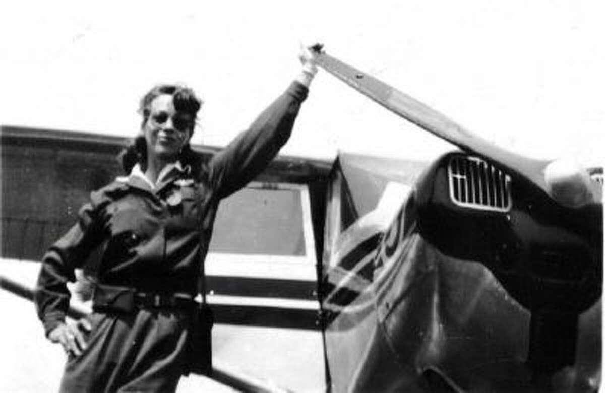 Dorothy "Dot" Lewis, seen in this undated image next to one of the planes she used to teach male pilots to fly during World War II.