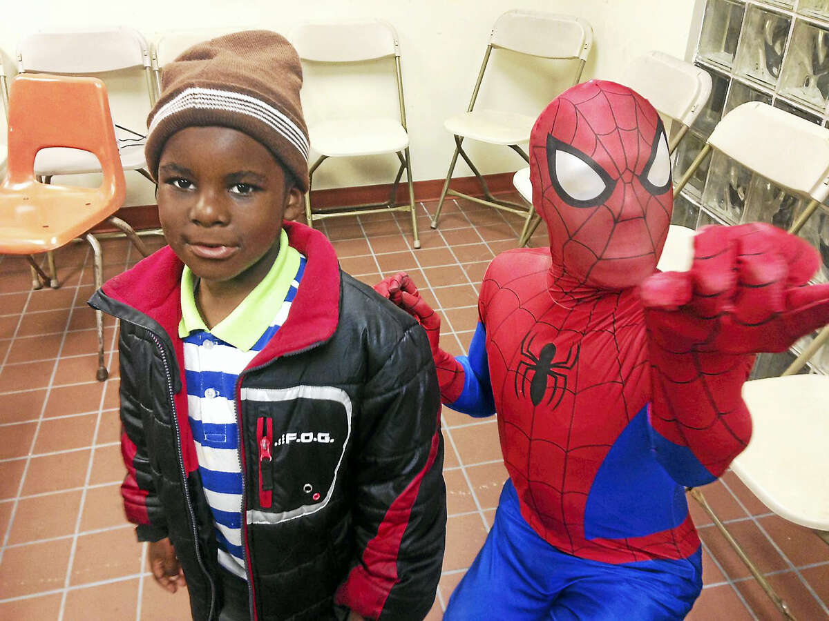 New Haven police hosted families in Westville for a Halloween night at the District 2 substation. Students from Southern Connecticut State University volunteered to dress in costumes, face paint, tattoo, and give candy to the kids.