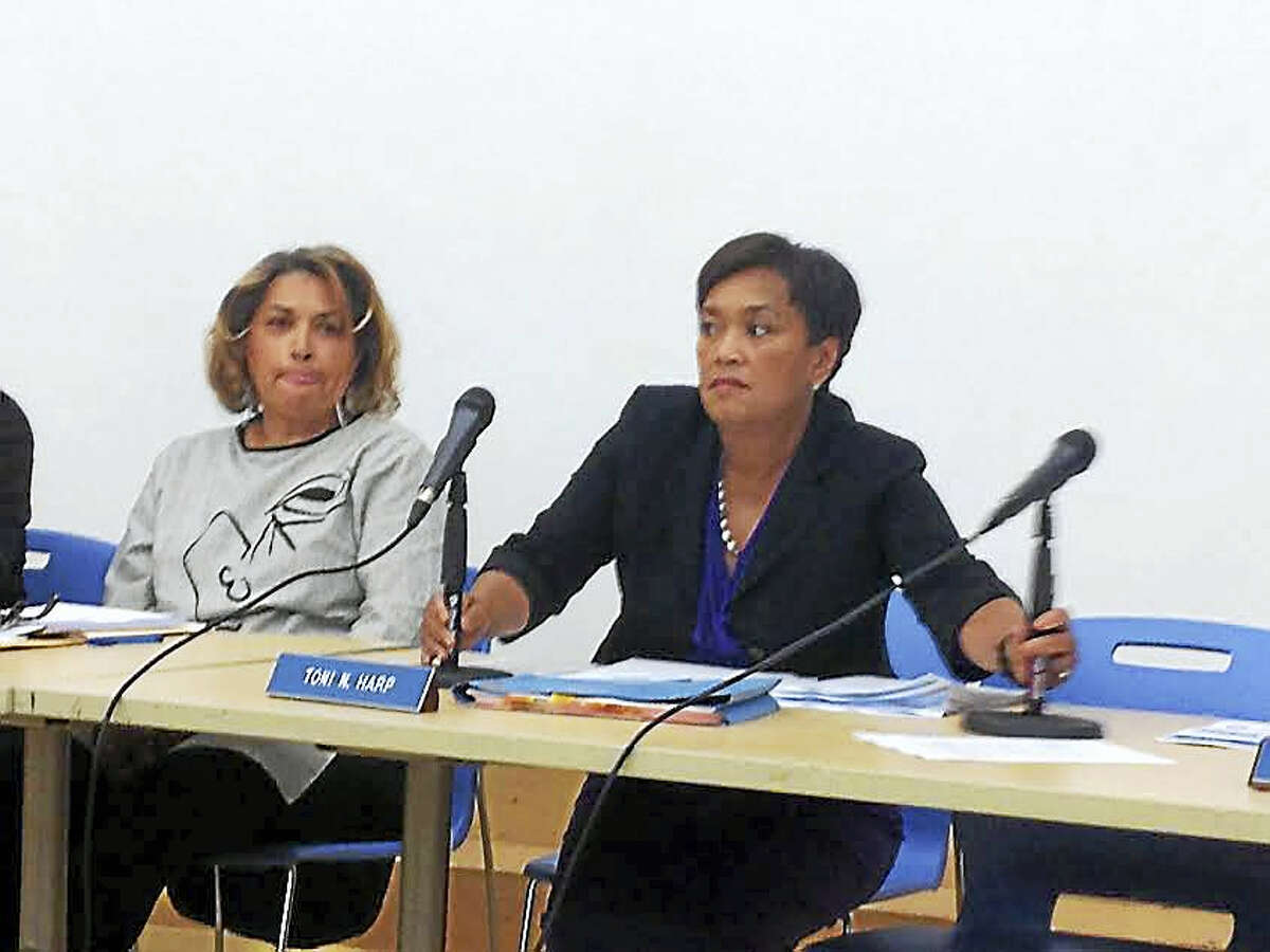 (Brian Zahn - The New Haven Register) Mayor Toni Harp and Alicia Caraballo sit beside one another before a Sept. 26 meeting of the Board of Education without acknowledging one another.