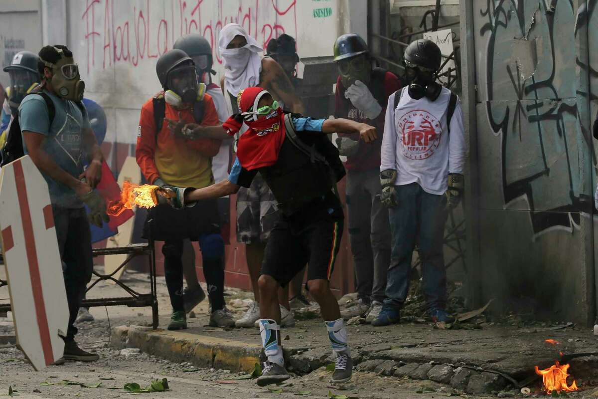 Anti-government protesters in Caracas, Venezuela, clashed with security forces Saturday during a march to the Supreme Court in opposition of President Nicolas Maduro's plan to rewrite the constitution.﻿