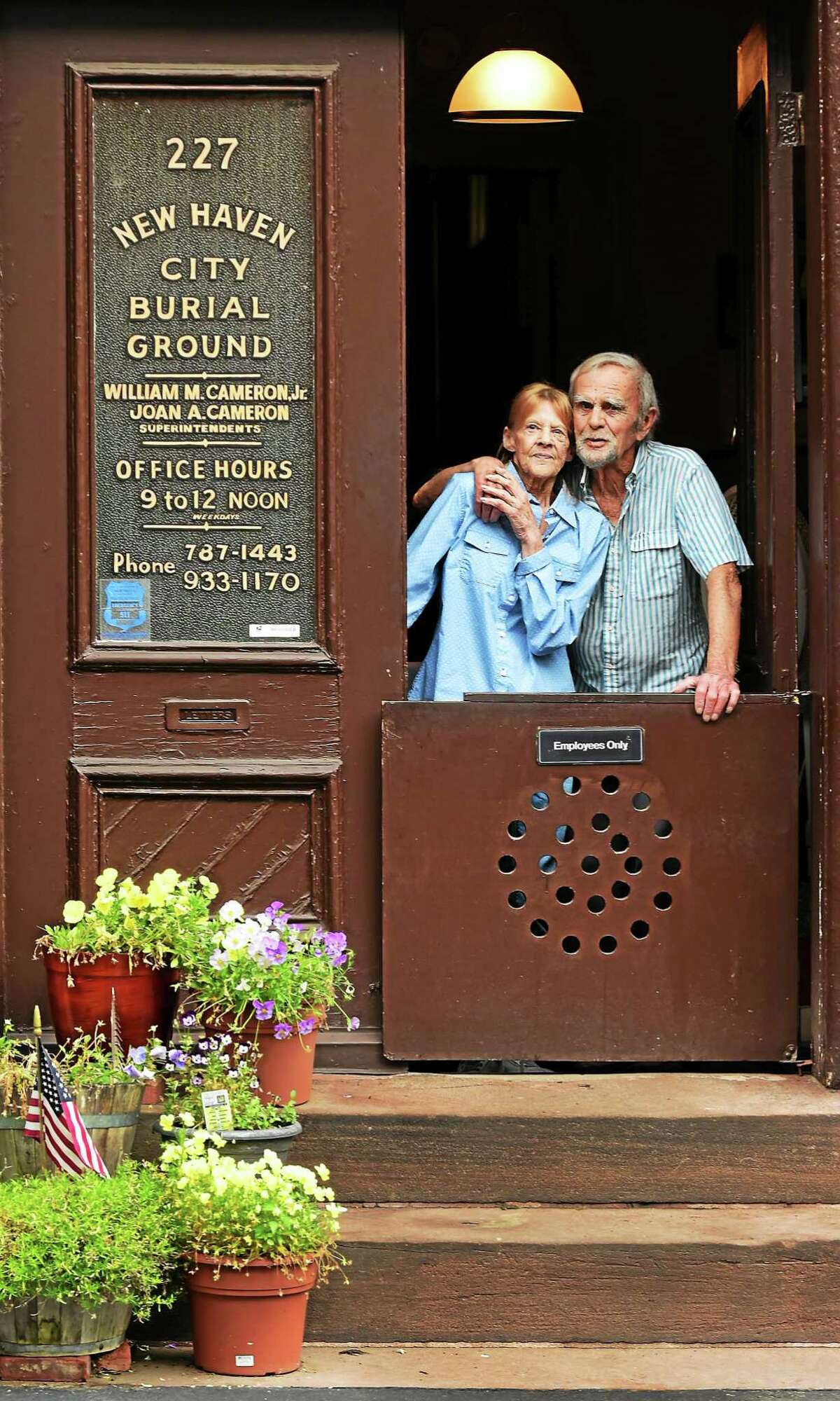 (Peter Hvizdak - New Haven Register) Joan Cameron and her husband, Bill Cameron, Jr., both superintendents of the Grove Street Cemetery, in New Haven, July 10, 2015.