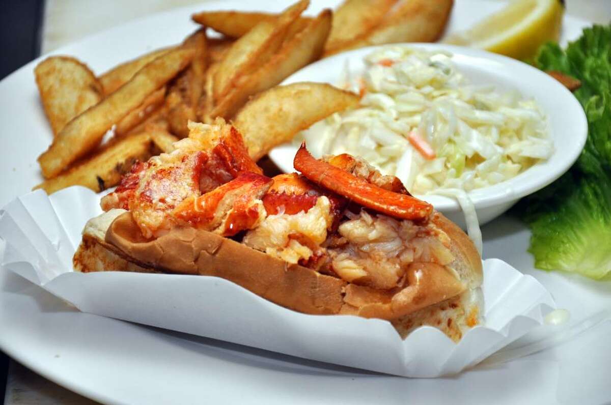 A freshly made hot lobster roll waits to be served on Friday, June 11, 2010 at 7 Seas Restaurant in Milford. Most agree that 7 Seas Restaurant located at 16 New Haven Avenue in Milford makes the best hot lobster roll.