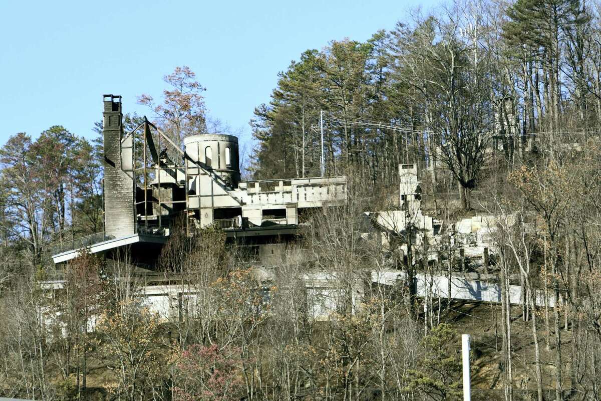 The burnt remains of a home known to visitors as The Castle is seen from downtown Gatlinburg, Tenn., Friday, Dec. 2, 2016. Residents were getting their first look at what remains of their homes and businesses in Gatlinburg, after a wildfire tore through the resort community on Monday, Nov. 28. (Michael Patrick/Knoxville News Sentinel via AP)