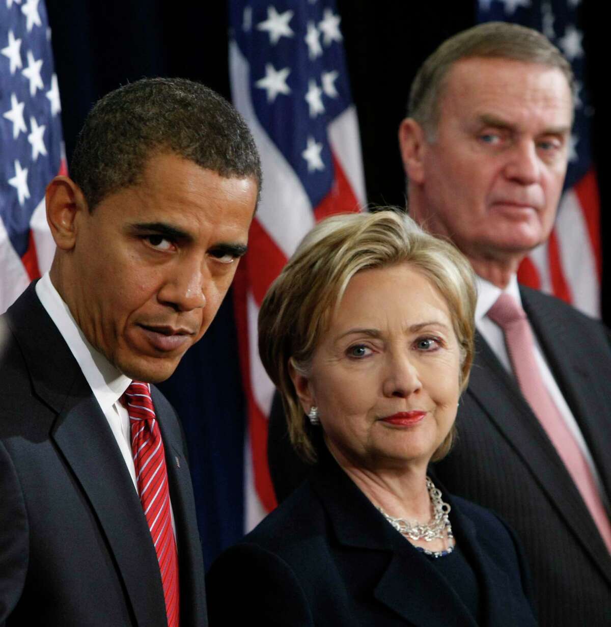 President-elect Barack Obama, left, stands with Secretary of State-designate Sen. Hillary Rodham Clinton, D-N.Y., center, and National Security Adviser-designate Ret. Marine Gen. James Jones, right, at a news conference in Chicago, Dec. 1, 2008. (AP Photo/Pablo Martinez Monsivais)