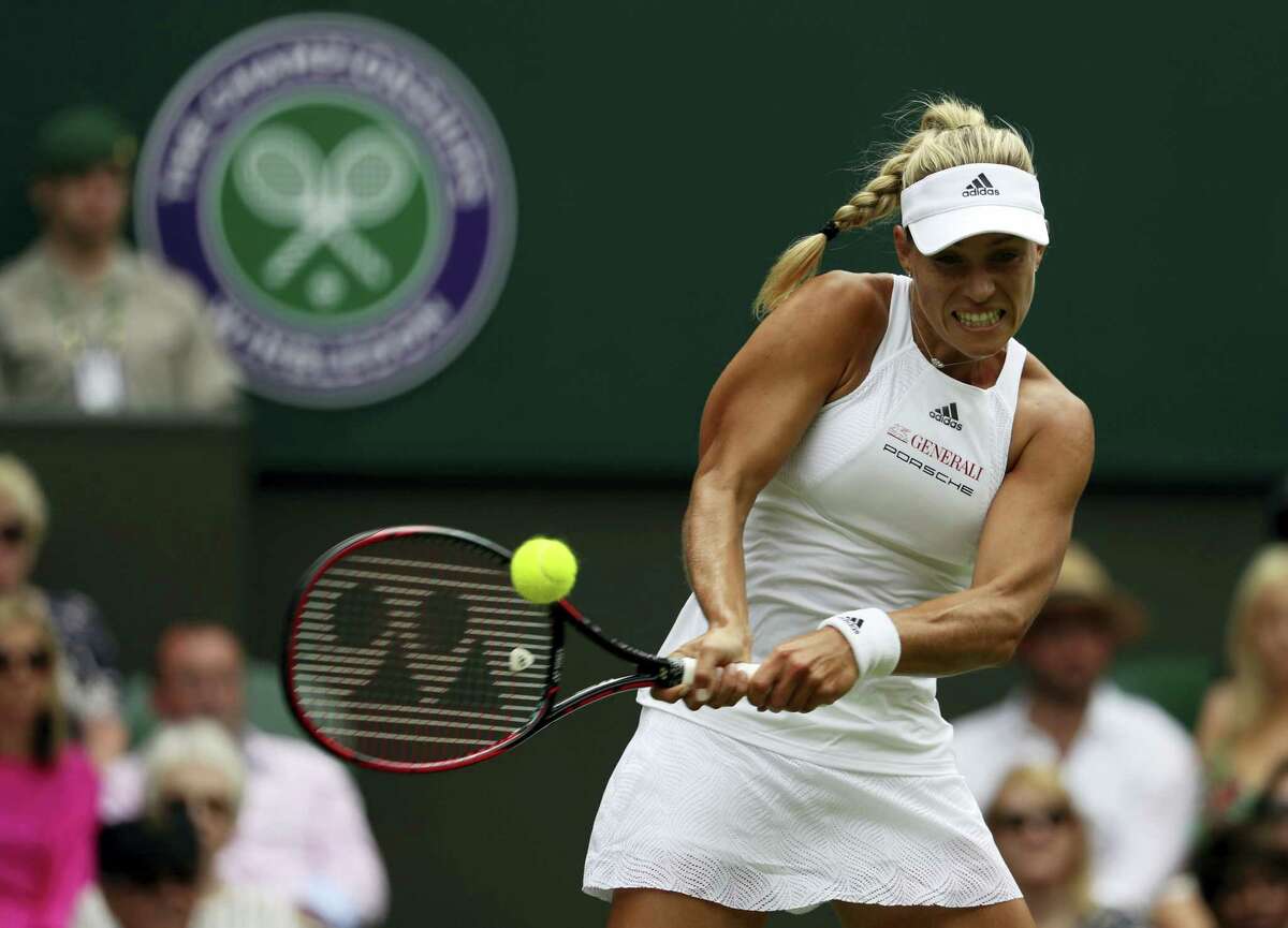 Angelique Kerber returns to Irina Falconi during their singles match on day two at the Wimbledon Tennis Championships in London Tuesday.