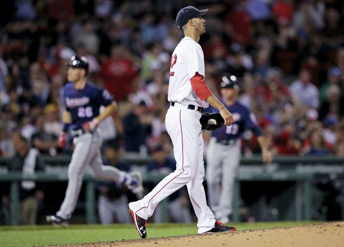 Red Sox starting pitcher Rick Porcello walks back to the mound as the Twins’ Max Kepler rounds the bases on his two-run home run during the sixth inning Wednesday.