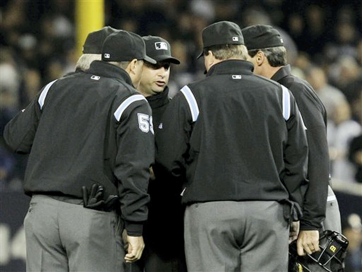 MLB umpires may get on-field microphones to explain replay review