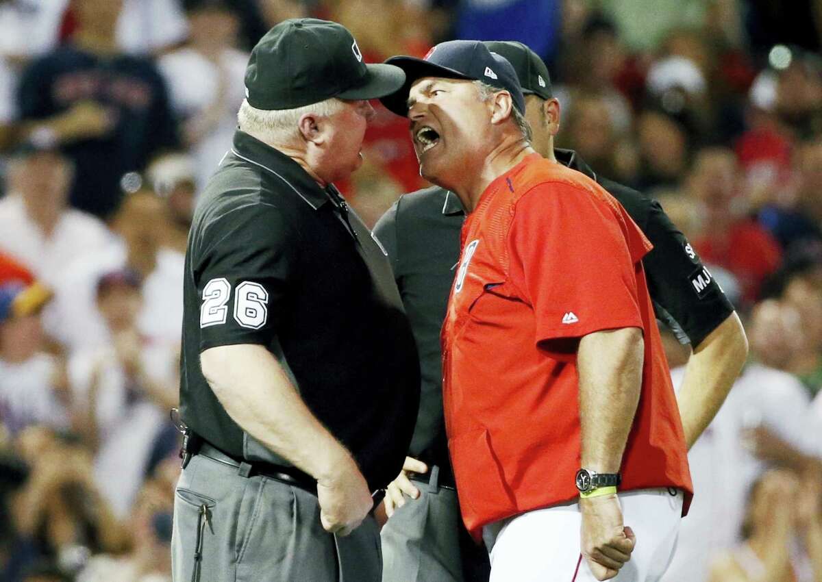 Red Sox manager John Farrell, right, argues with third base umpire Bill Miller after a called balk during the seventh inning Saturday.