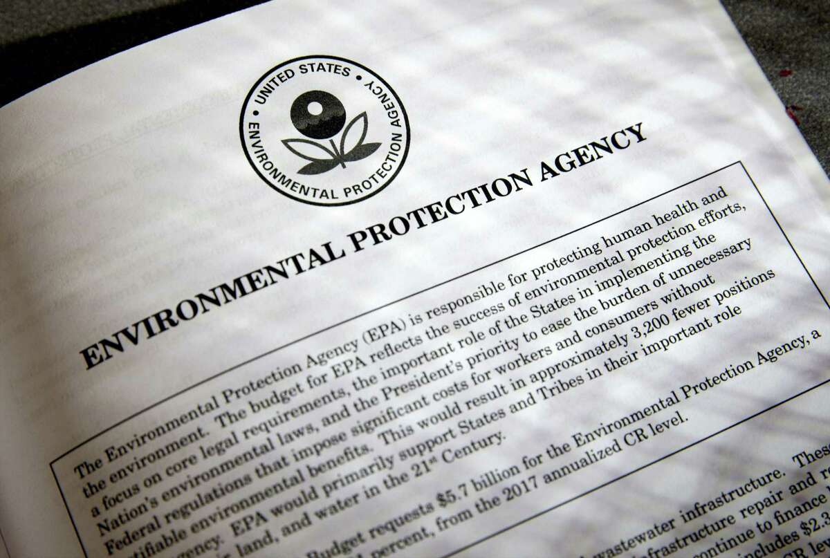 In this March 16, 2017 photo, proposals for the Environmental Protection Agency (EPA) in President Donald Trump’s first budget are displayed at the Government Printing Office in Washington. President Donald Trump will sign an executive order on March 29 that will suspend, rescind, or flag for review more than half-a-dozen measures that were part of former President Barack Obama’s sweeping plan to curb global warming.