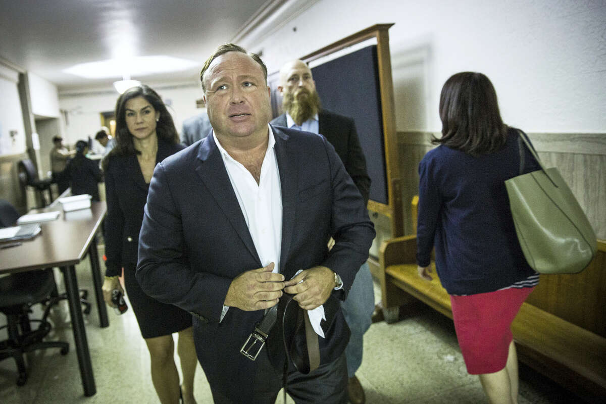 In this Monday, April 17, 2017 photo, “Infowars” host Alex Jones arrives at the Travis County Courthouse in Austin, Texas. Jones, the right-wing radio host and conspiracy theorist, is a performance artist whose true personality is nothing like his on-air persona, according to a lawyer defending the “Infowars” broadcaster in a child custody battle. (Tamir Kalifa/Austin American-Statesman via AP)