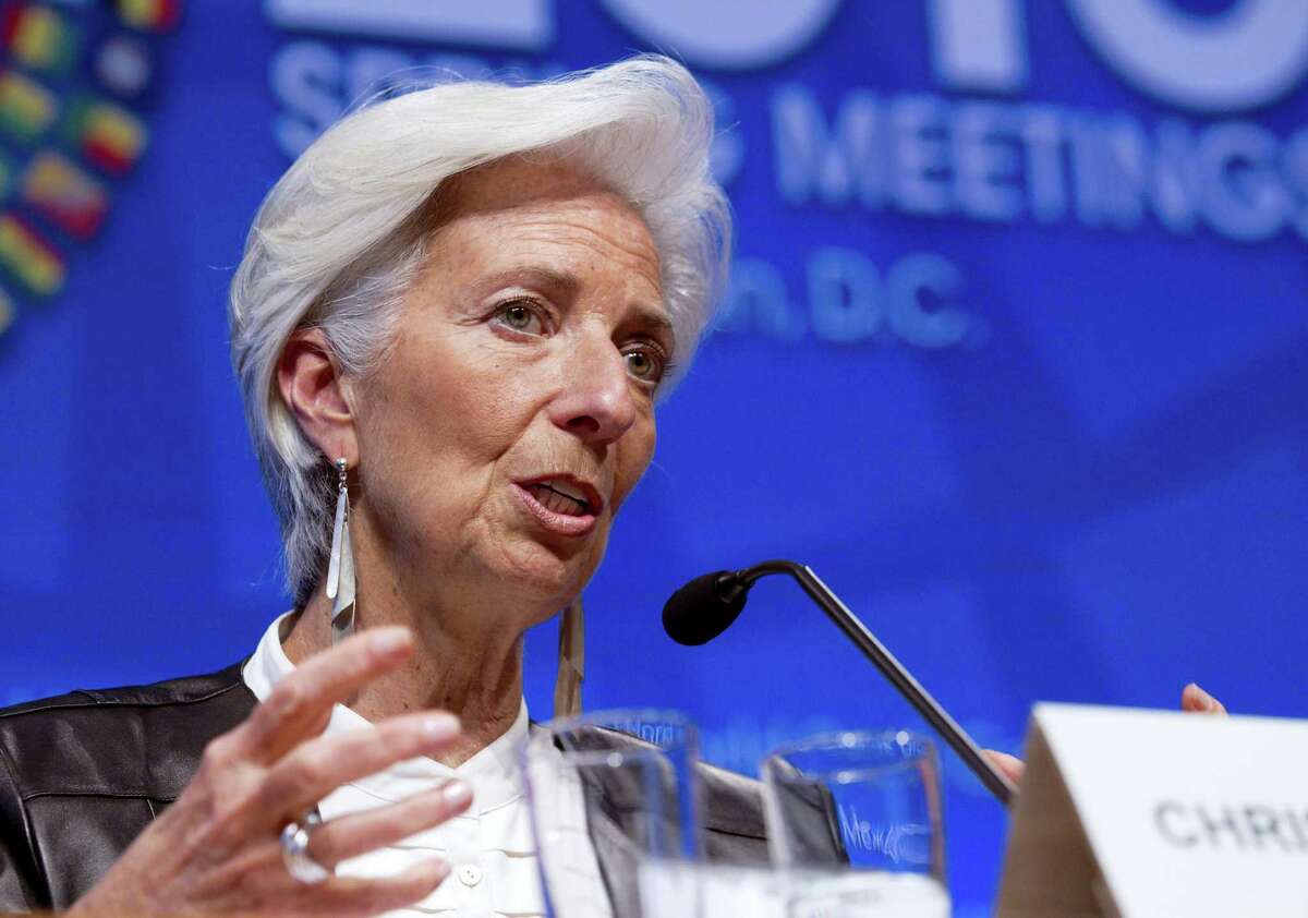 In this April 16, 2016 photo, International Monetary Fund Managing Director Christine Lagarde speaks during a news conference after the International Monetary and Financial Committee (IMFC) conference at the World Bank/IMF Spring Meetings at IMF headquarters in Washington. A resilient China, rising commodity prices and sturdy financial markets are offering a sunnier outlook for the global economy and helping dispel the gloom that has lingered since the Great Recession ended, according to the IMF, which predicts that the world economy will grow 3.5 percent in 2017, up from 3.1 percent in 2016.