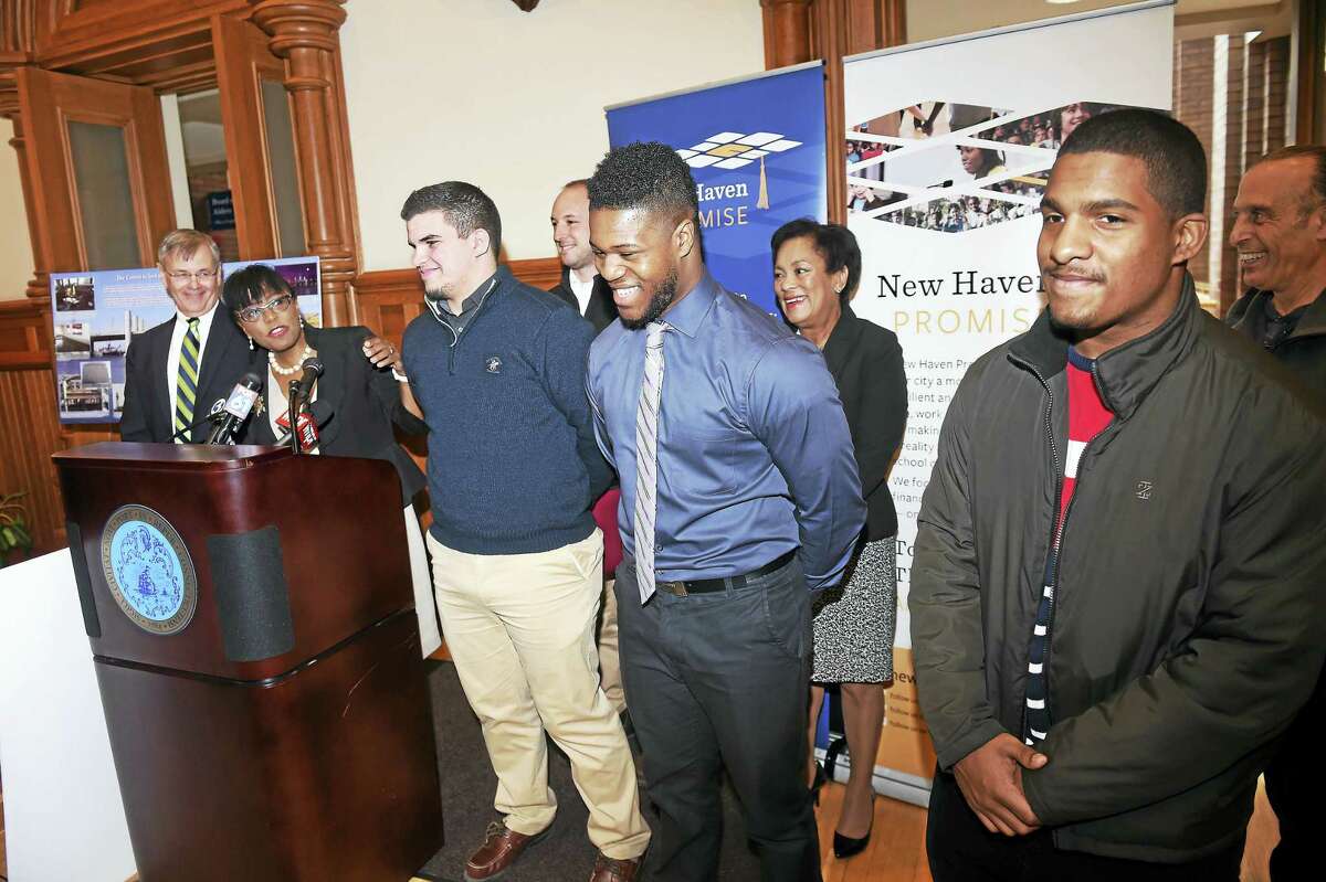 From left, State Department of Transportation Commissioner James Redeker listens to New Haven Promise Executive Director Patricia Melton honor University of New Haven mechanical engineering student Kevin Rivas, Gateway Community College manufacturing engineering student Jevaughn Brodie, and prospective mechanical engineering student Jose Sanchez of the Sound School Tuesday.