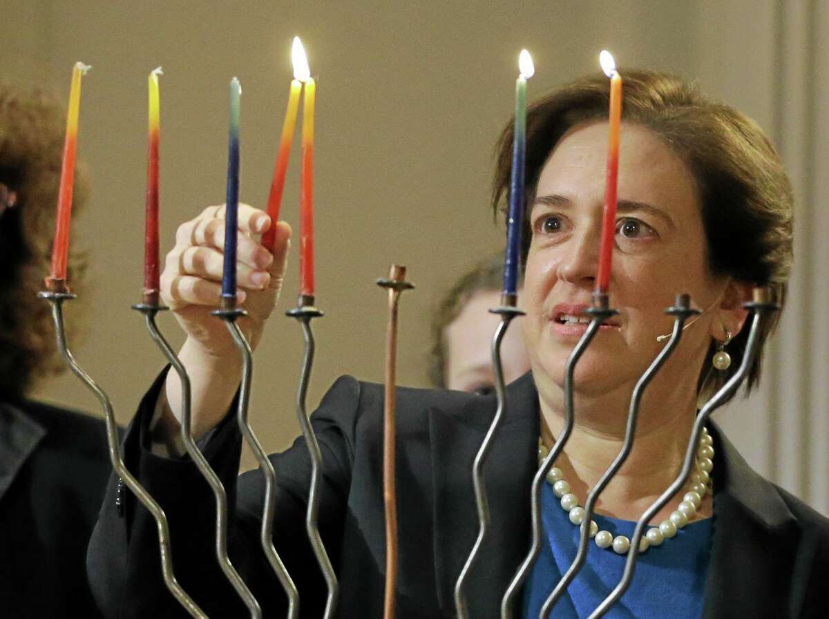 Supreme Court Justice Elena Kagan lights a menorah before speaking at the 6th & I Historic Synagogue in Washington.