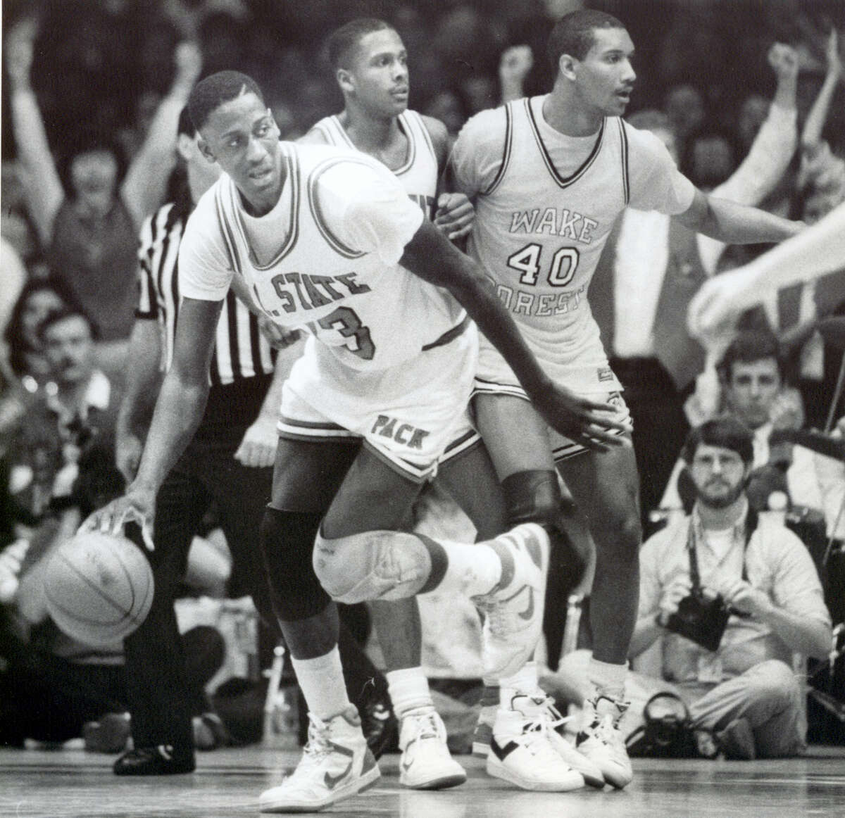 In this March 6, 1988 photo, North Carolina State NCAA college basketball player Charles Shackleford, left, plays against Wake Forest during a game in Raleigh, N.C. Shackleford, a North Carolina State basketball star in the 1980s who spent six seasons in the NBA, was found dead in his home on Jan. 27, 2017 in Kinston. He was 50.