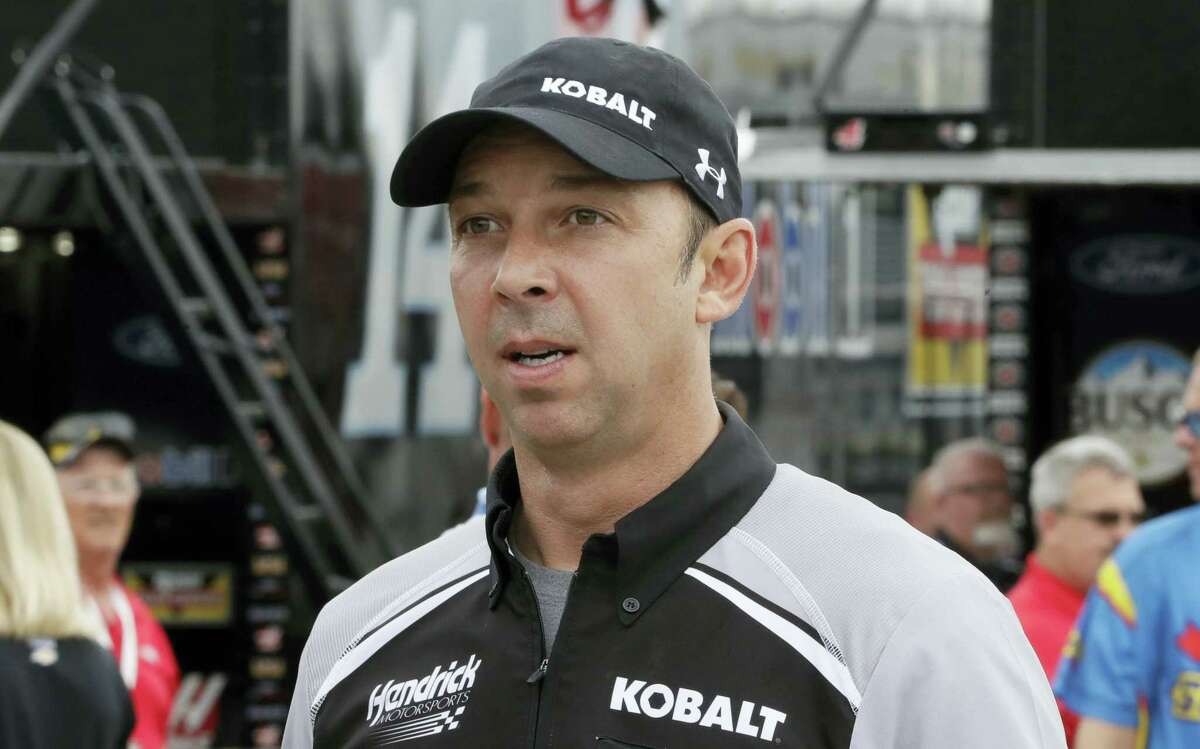 Chad Knaus, crew chief for Jimmie Johnson walks in the garage area before a practice session.