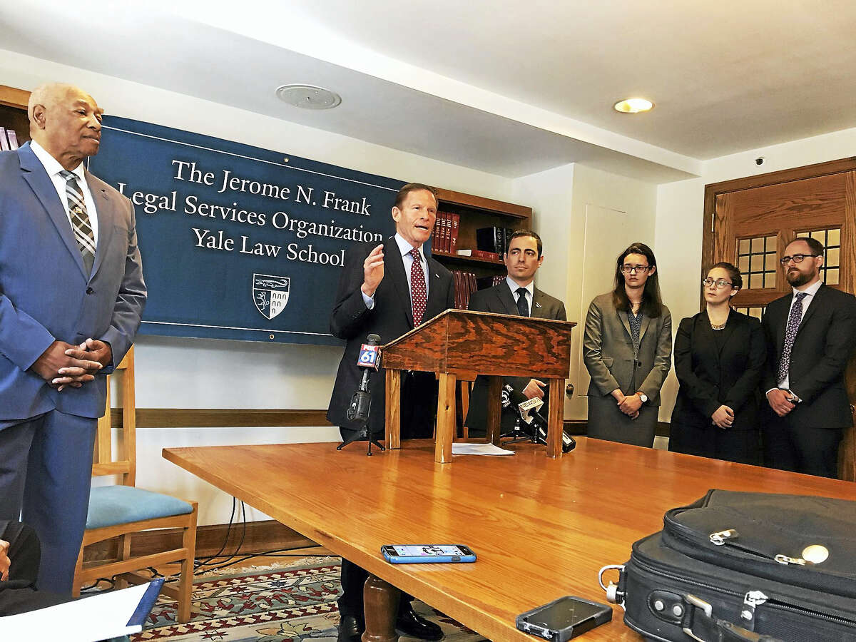 From left, Conley Monk, a Vietnam veteran who had his discharge upgraded after 45 years, listens to U.S. Sen. Richard Blumenthal at the Yale Law School Monday. Steve Kennedy, next to Blumenthal, has filed a class action suit to force a review panel to give “liberal consideration” to PTSD diagnoses.