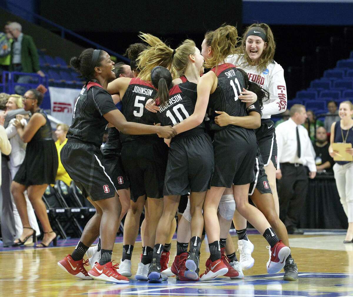 Members of the Stanford women’s team celebrate after defeating Notre Dame to advance to the Final Four on Sunday.
