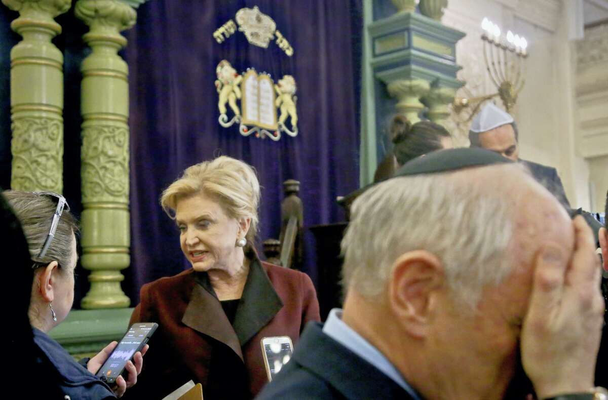 In this March 3, 2017 photo, Congresswoman Carolyn Maloney, center, a member of Congress’s bipartisan task force combating anti-Semitism, speaks with a reporter after holding a news conference to address bomb treats against Jewish organizations and vandalism at Jewish cemeteries at the Park East Synagogue in New York. Kendall Sullivan, a Connecticut man who posted threats against Jews and synagogues on a metal music internet forum plans to argue at his sentencing that he has served enough time in prison. Sullivan is scheduled to go before a U.S. District judge in Bridgeport on Monday, April 17. He pleaded guilty in January to perpetrating a hoax and originally faced three federal charges of making online threats.