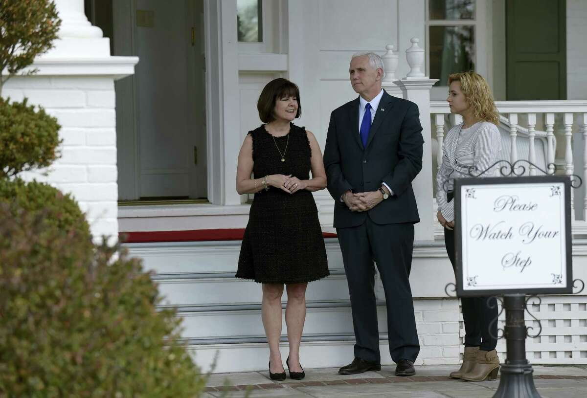 Vice President Mike Pence, his wife Karen Pence, left, and daughter Charlotte Pence, wait to greet governors to the Naval Observatory Washington, Friday.