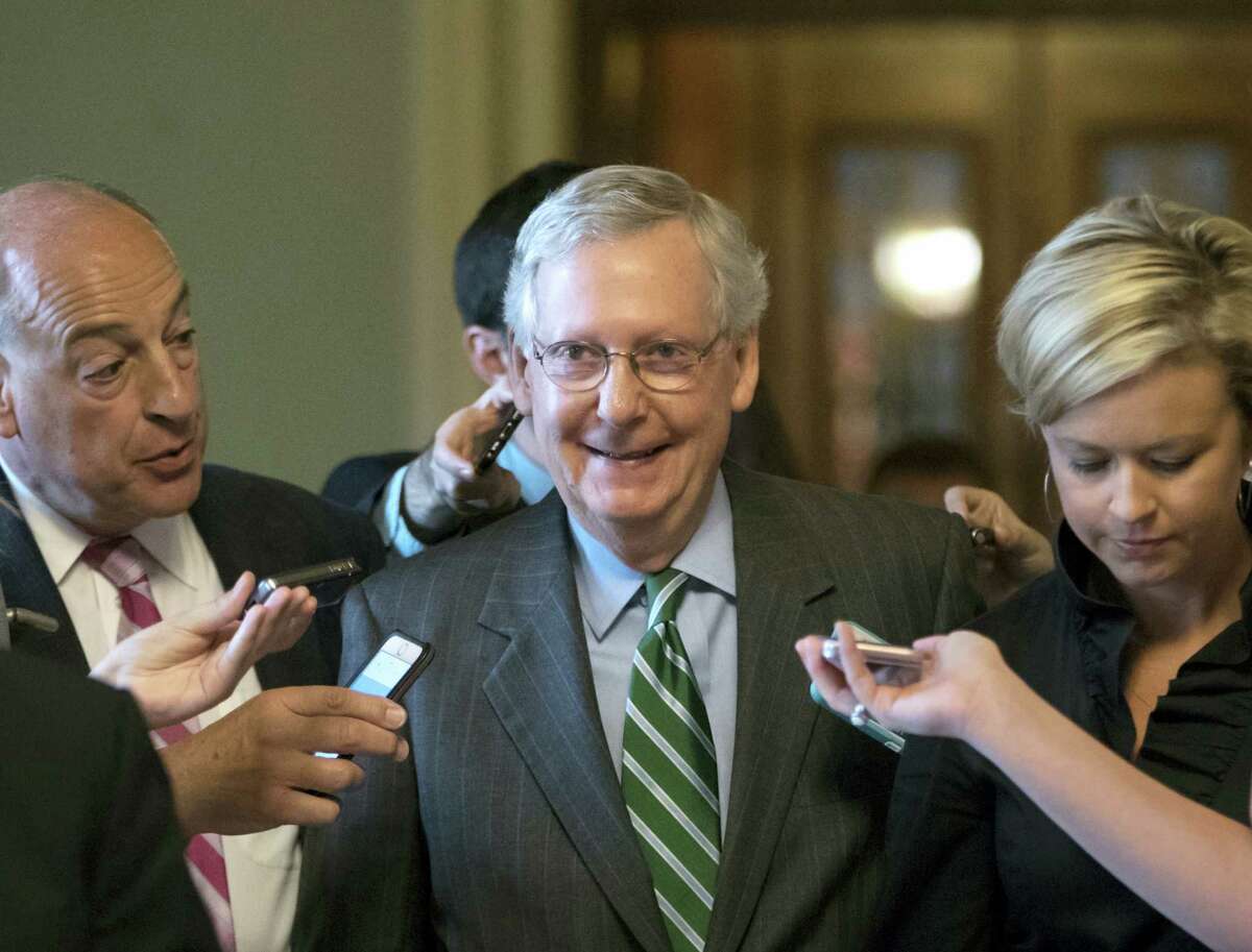 Senate Majority leader Mitch McConnell smiles as he leaves the chamber after announcing the release of the Republicans’ health care bill, which represents the party’s long-awaited attempt to scuttle much of President Barack Obama’s Affordable Care Act, at the Capitol in Washington, Thursday, June 22, 2017.