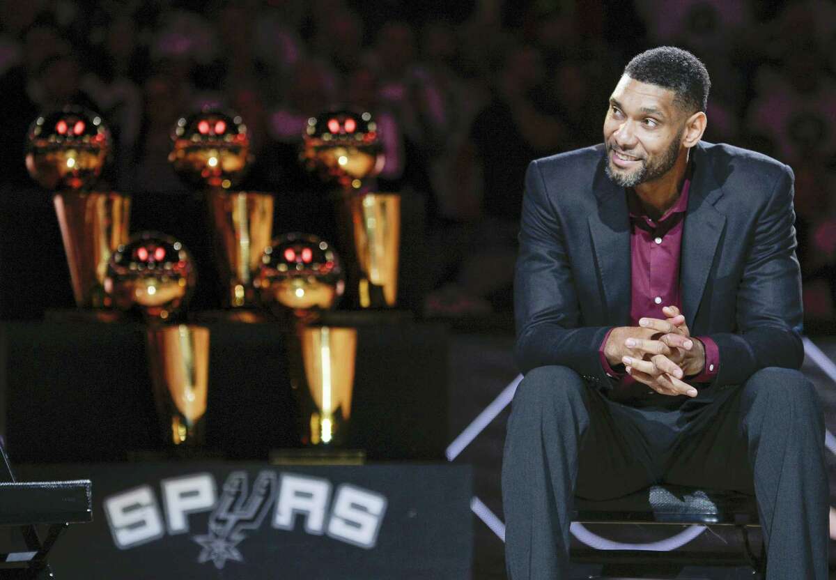 In this Dec. 18, 2016 photo, San Antonio Spurs’ Tim Duncan listens while special guests speak about him during his jersey retirement ceremony, in San Antonio. There was a mad scramble at the Spurs practice during the Western Conference finals, a flurry of activity to position cameras and get recording devices ready to document essentially what was the sighting of a white whale. Tim Duncan, the NBA’s most reclusive star, had apparently accepted a request to speak publicly for the first time since quietly retiring in the offseason.