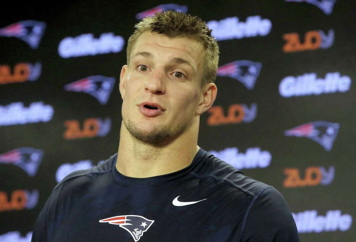 A young New England Patriots fans tries on a Rob Gronkowski jersey