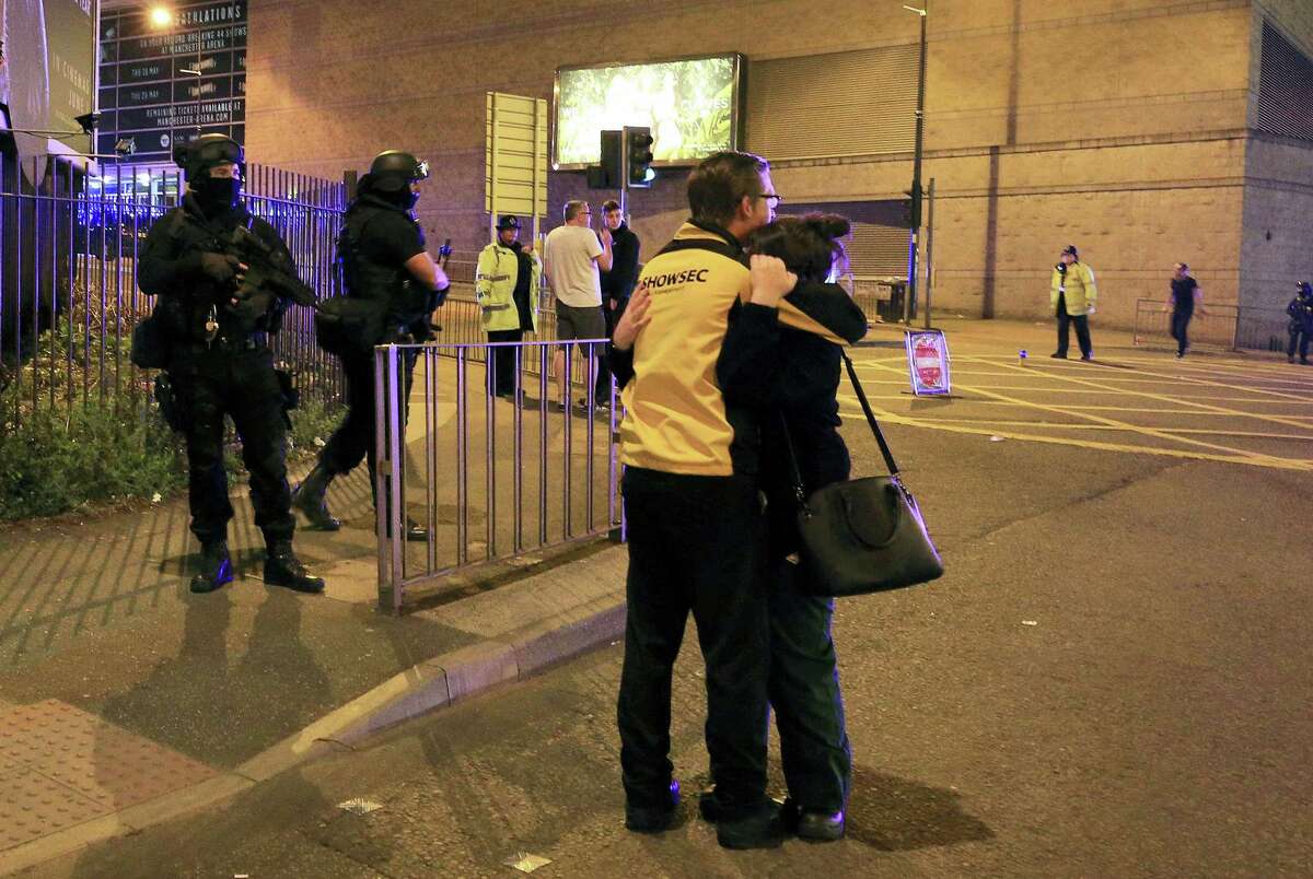 Armed police stand guard at Manchester Arena after reports of an explosion at the venue during an Ariana Grande gig in Manchester, England Monday, May 22, 2017. Police says there are “a number of fatalities” after reports of an explosion at an Ariana Grande concert in northern England.