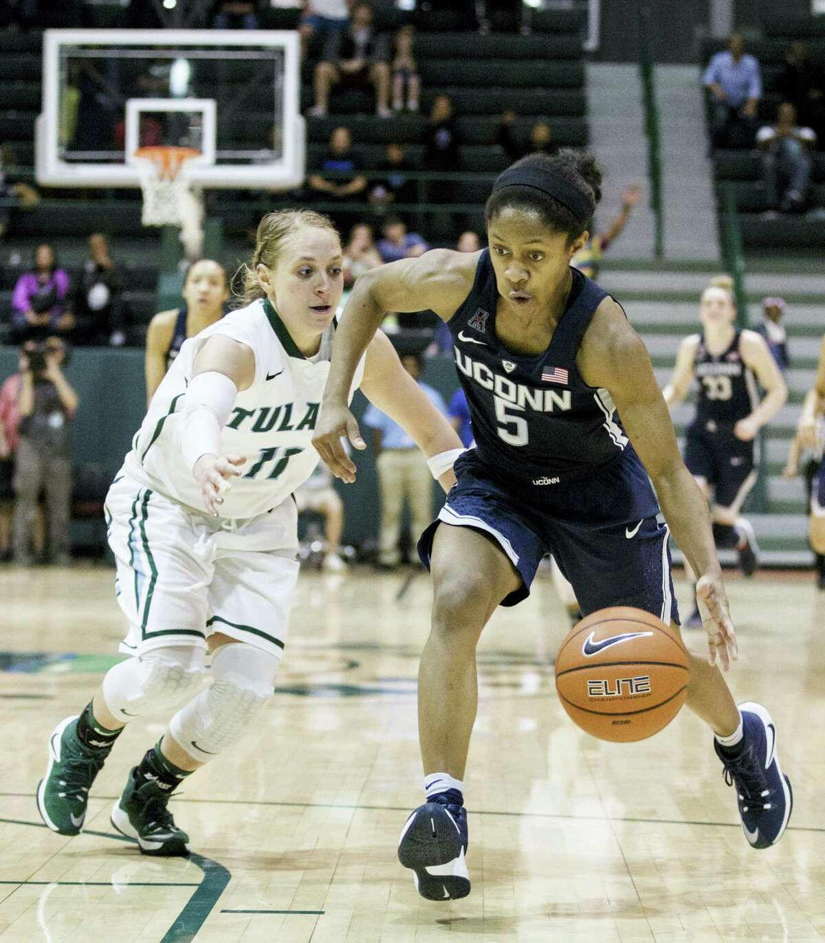 Tulane guard Leslie Vorpahl runs after UConn guard Crystal Dangerfield during the second half of the Huskies’ victory Saturday against Tulane.